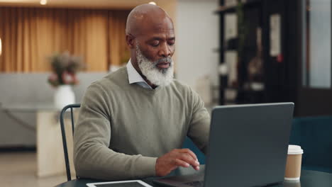 senior, black man and typing on laptop in coffee