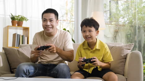 asian man and boy in the living room