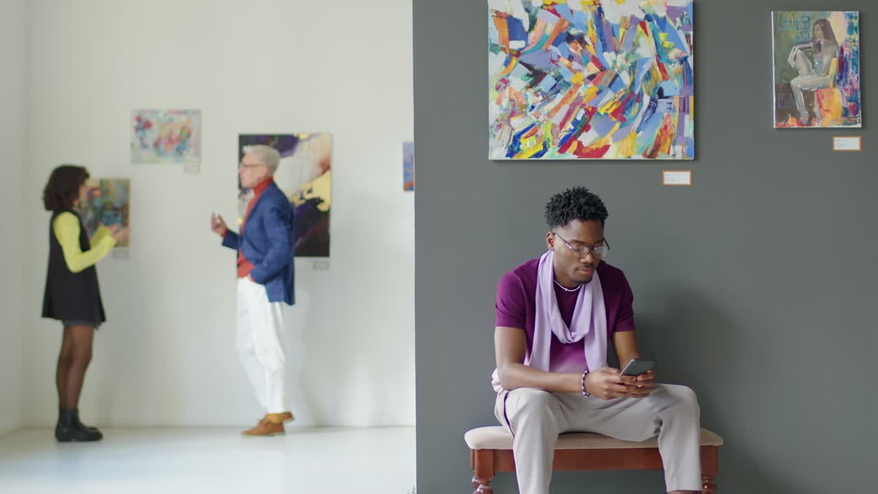 African American Man Sitting in Art Gallery