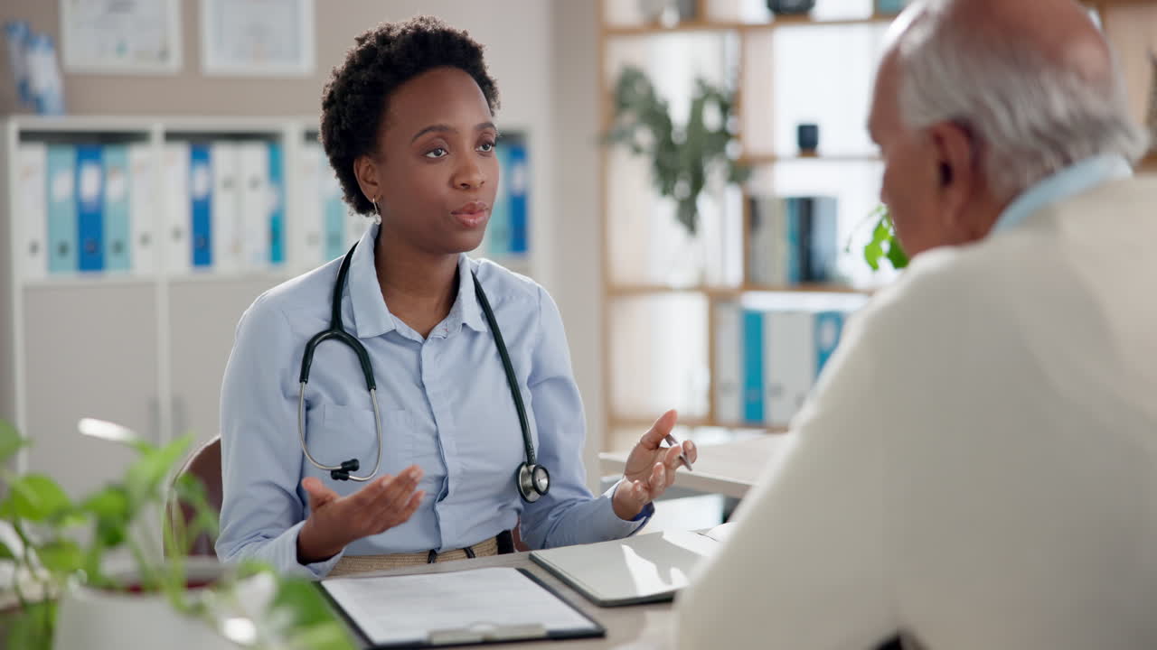 Doctor consulting with elderly patient
