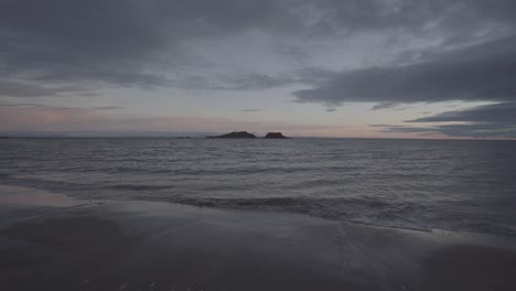beautiful wide angle view of scottish beach during sunrise moment of the day