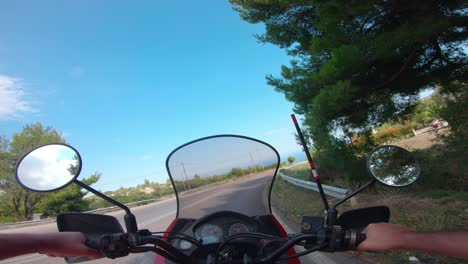 riding a motorcycle on penteli mountain in greece