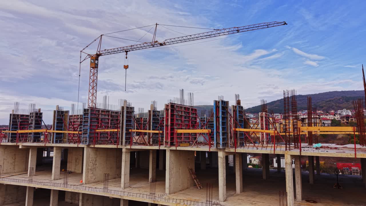 Construction site with crane and concrete structures under development