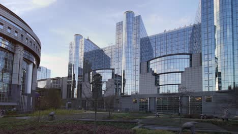 european parliament in brussels, a modern glass building that houses the legislative chamber of the european union, where eu laws are discussed by european politicians representatives