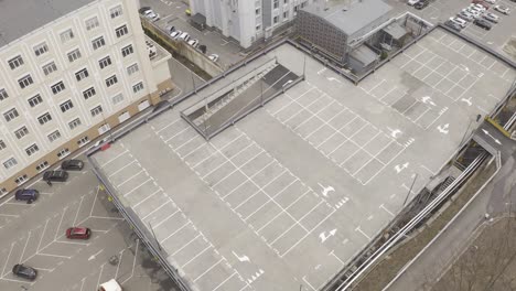 aerial view of rooftop parking garage in a city