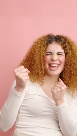 young woman showing different facial expressions on pink background