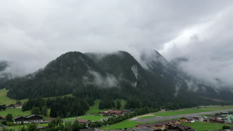 drone shot of three hills in the swiss alps - gstaad, saanen, switzerland - slowly up