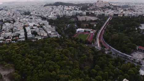 view over urban landscape of athens in greece - aerial drone shot