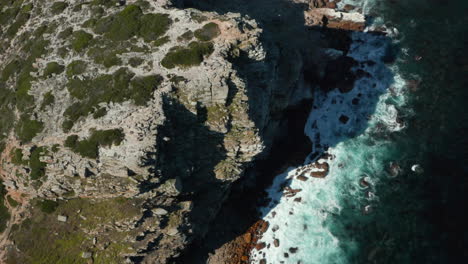 Top-View-Of-Rugged-Landscape-Of-The-Rocky-Cliff-At-The-Coast-Of-Cape-Town,-Africa