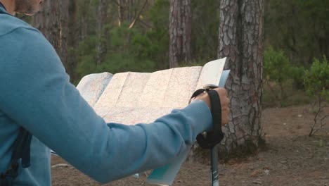 crop male traveler reading map