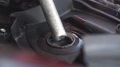 Closeup-of-fuel-nozzle-ejects-benzine-to-motorcycle-or-scooter-fuel-chamber