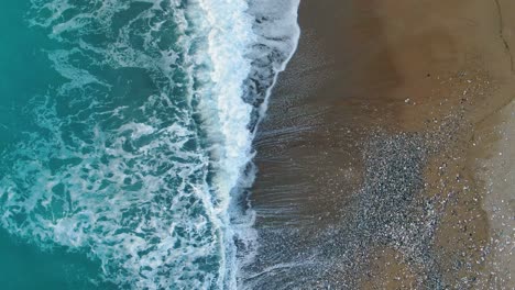 Aerial-view-of-waves-in-Agios-georgios-beach-in-corfu-island-greece