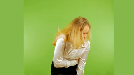 4k. the young girl blondes stomach ache. mockup.  isolated on a green background.  chromakey.