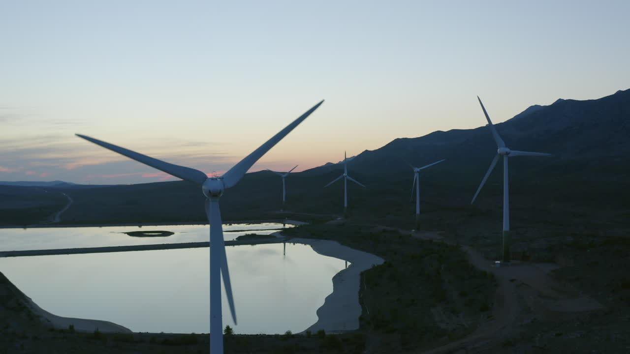 Wind Farm at Sunset with Mountain View