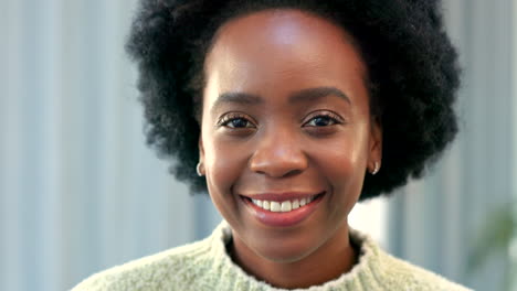 Portrait-of-laughing-african-woman-smiling-at-home