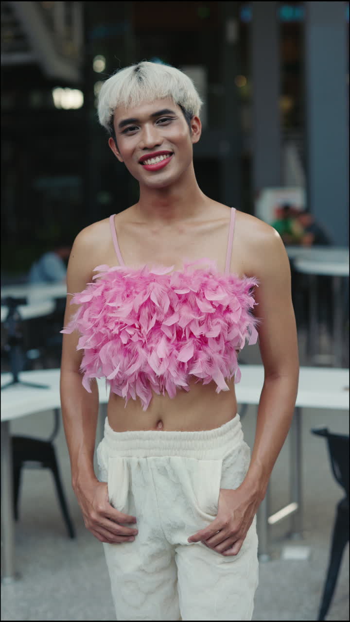 Man in Pink Feather Top and White Pants