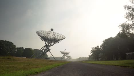 radio telescopes in a misty landscape