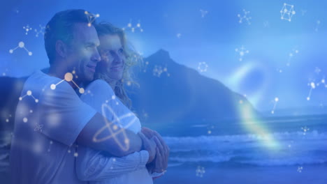 mature couple hugging on seaside beach at dusk, with glowing technology molecular network overlay