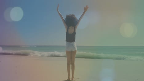 standing on beach, person raising arms facing ocean waves, imagining animation