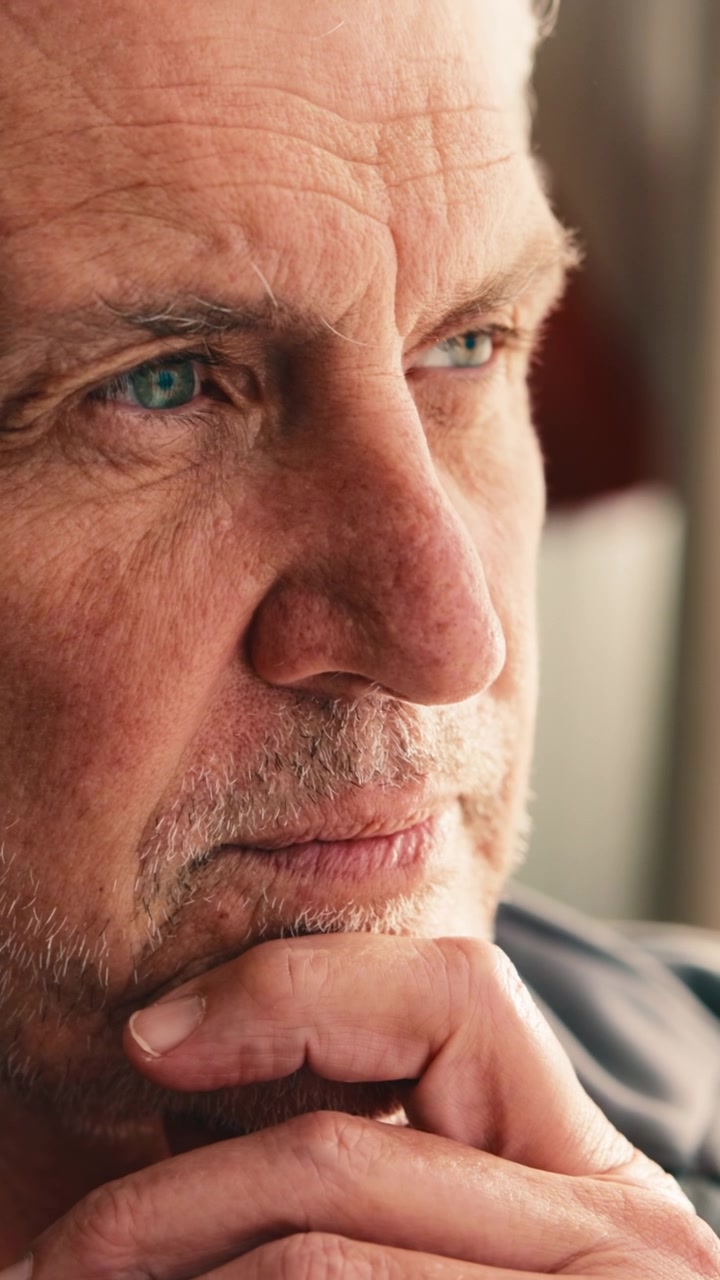 Thoughtful Senior Man Resting Chin on Hand