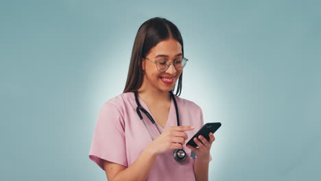 Phone,-smile-and-woman-nurse-in-a-studio