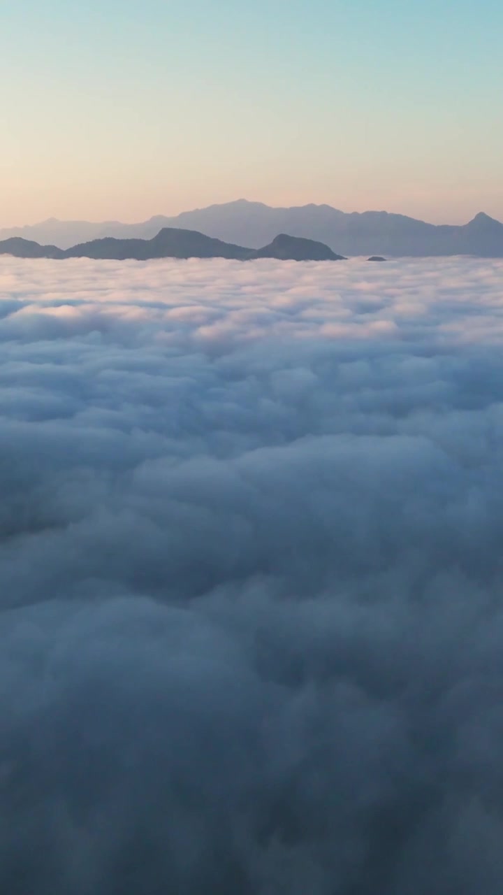 Vertical Drone fly above white clouds, sky covered, white cloudscape, mountain sunset background at Tropical Area