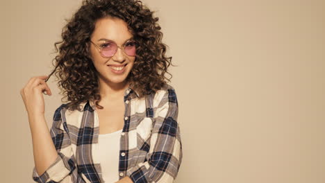 woman with curly hair and plaid shirt
