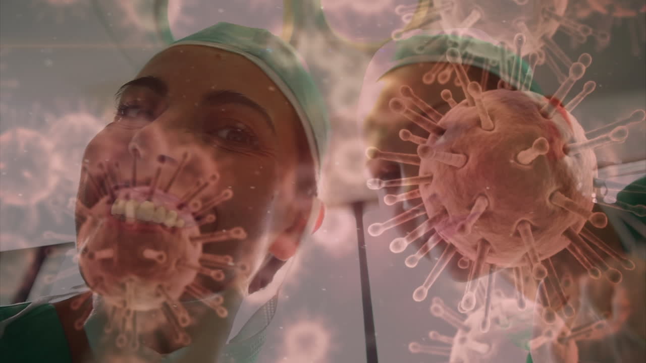 animación de células de covid-19 sobre diversos cirujanos que usan máscaras faciales en el quirófano