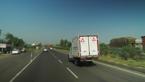 point of view shot of mahindra bolero vaccine van on the highway in maharashtra