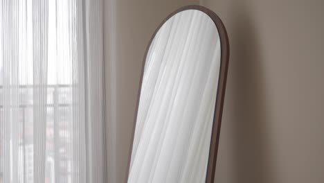 full length arched mirror with wooden frame