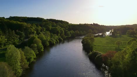 vienne river crossing saint-victurnien verdant countryside at sunset, nouvelle-aquitaine in france