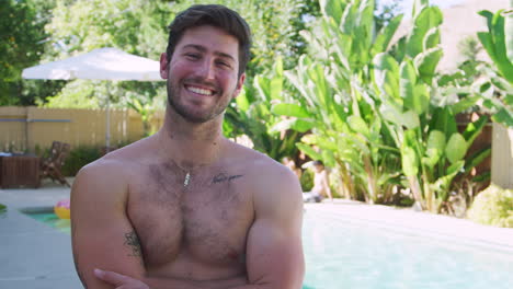 Portrait-Of-Smiling-Bare-Chested-Man-Outdoors-With-Friends-Enjoying-Summer-Pool-Party