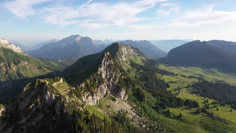 green meadows surrounded by granite cliffs in the french alps