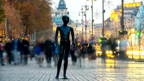 the black dummy standing in a people crowd in the street. time lapse