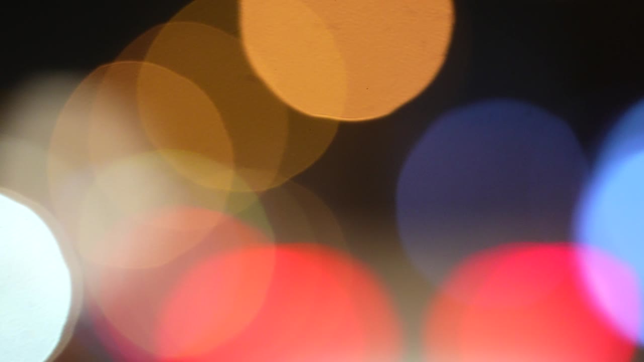 Colorful defocused bokeh background. Shiny glow, glitter light effect. Bokeh circle background.