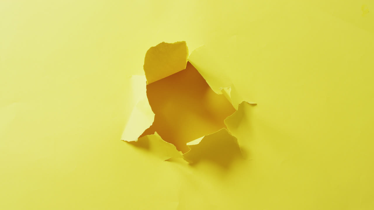 Video of close up of tron yellow paper on yellow background