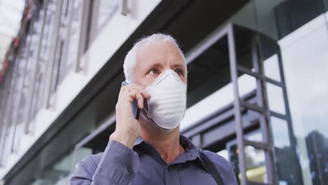 Caucasian-man-out-and-about-in-the-street-wearing-on-a-face-mask-against-coronavirus