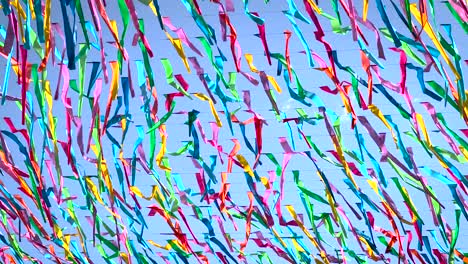 Hundreds-of-colorful-flags-flutter-in-the-wind-hanging-as-ornaments-in-the-streets-of-Oaxaca