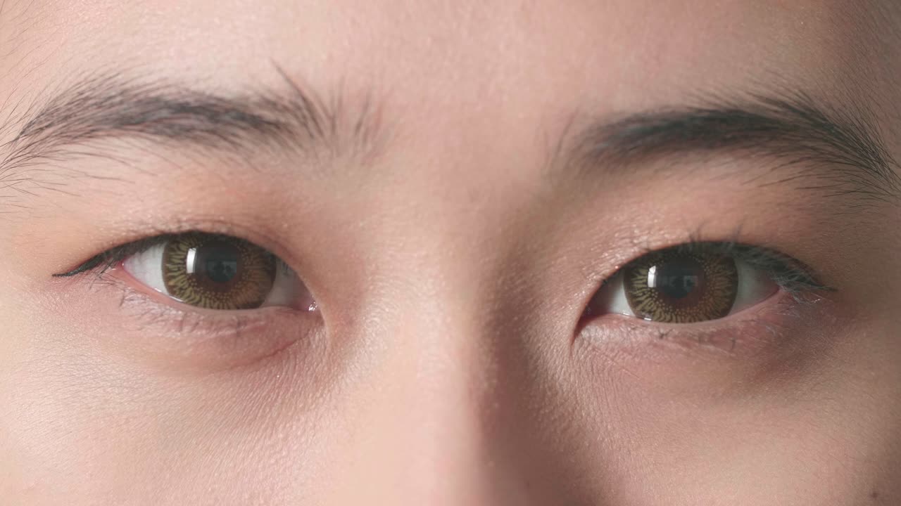 Close-up of woman's eyes with brown contact lenses