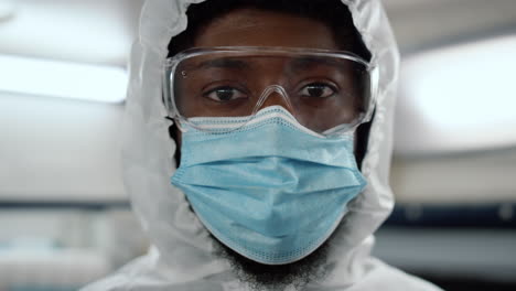 close up view of african american doctor in protective glasses