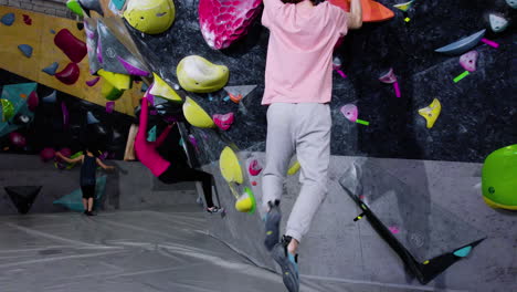 teenagers bouldering in a gym