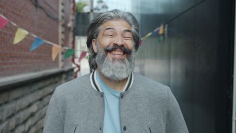 smiling older man in an alley