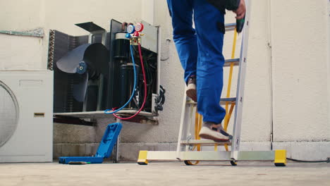 Electrician-climbing-down-on-ladder