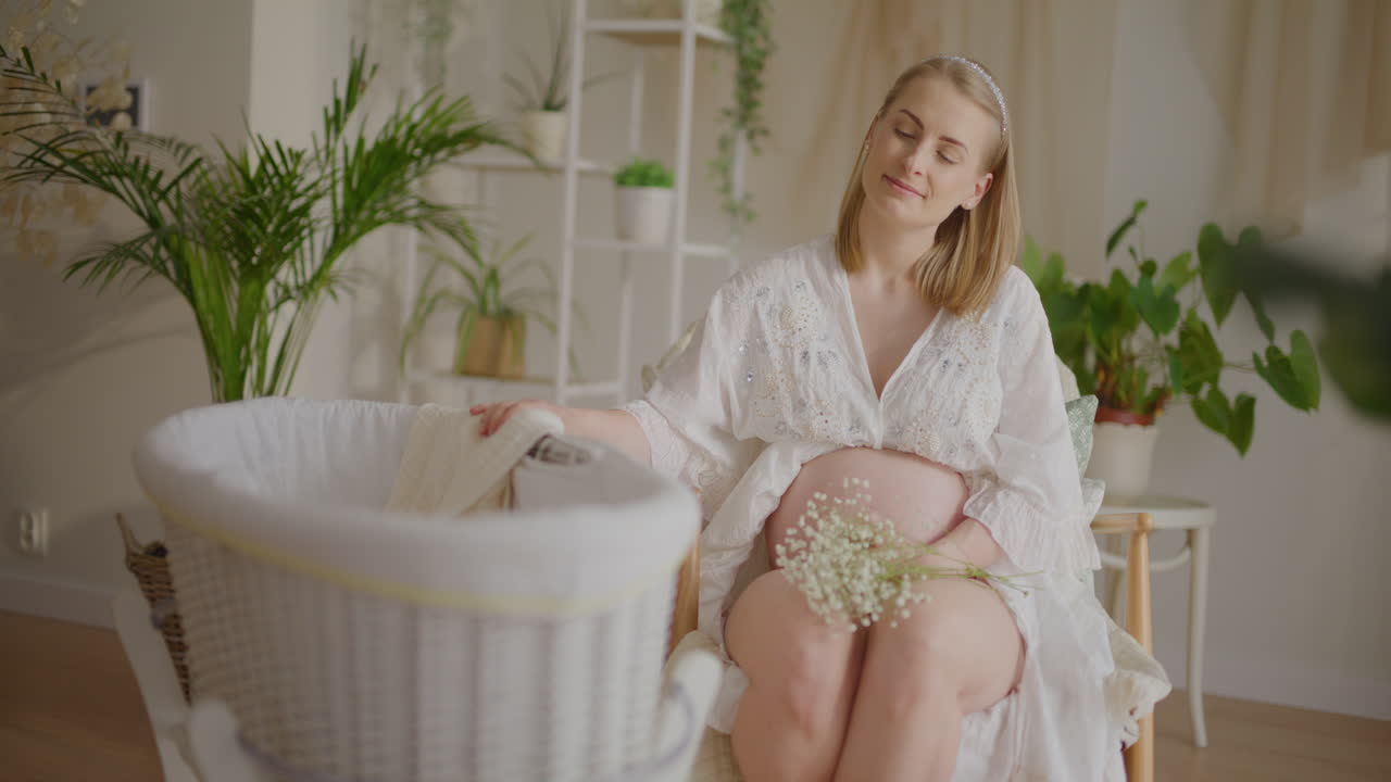 Pregnant Woman Swaying Baby Cradle