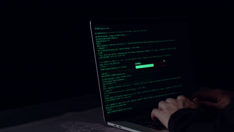 hands hacker using laptop computer hacking and success downloading data