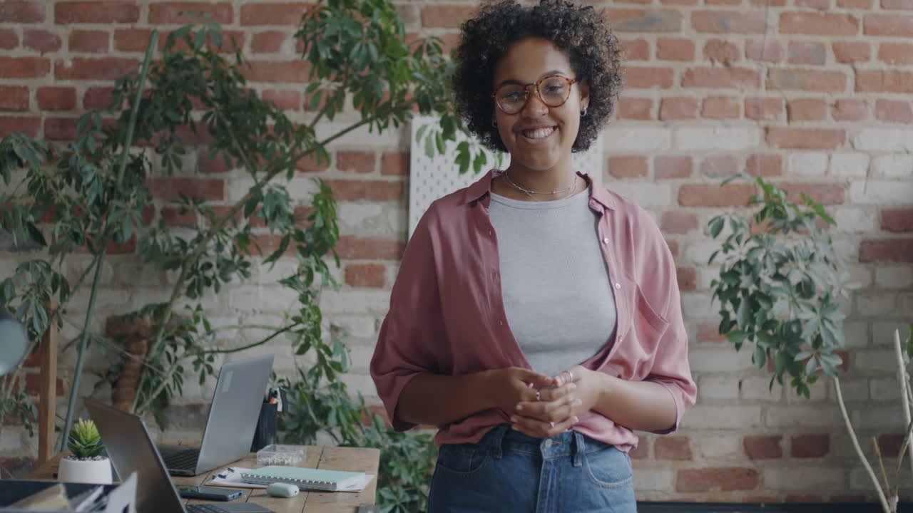 Woman Smiling in Modern Office