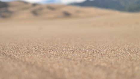 close up grains of sand blowing in the wind in the middle of desert in 4k