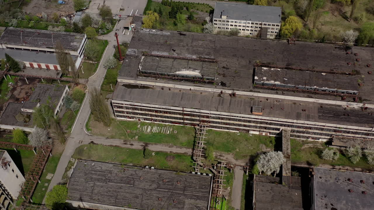 Big abandoned territory of an old factory. Ruined buildings of old industrial plant. Aerial view.