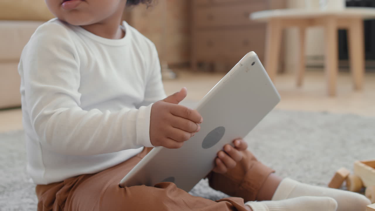 Close Up of Adorable Baby Boy with Tablet