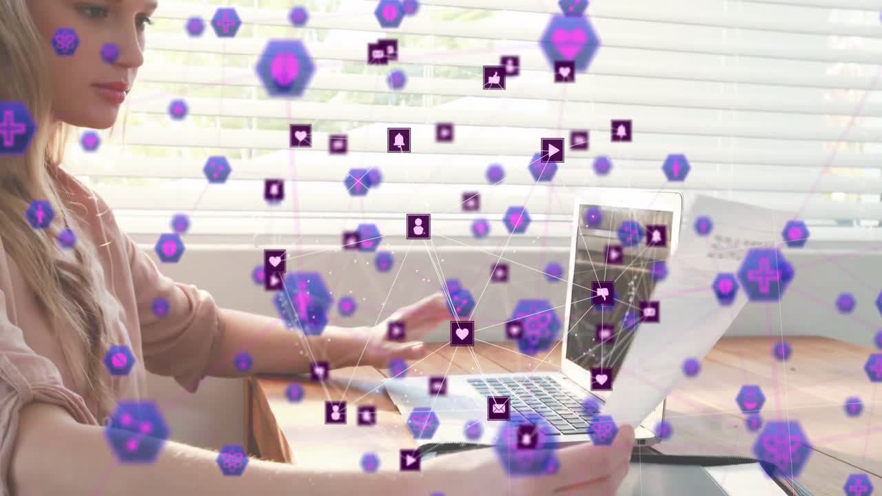 Hands typing on laptop initiating drifting icons with woman reviewing finance mortgage document